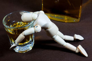 Small manakin drowning in alcohol