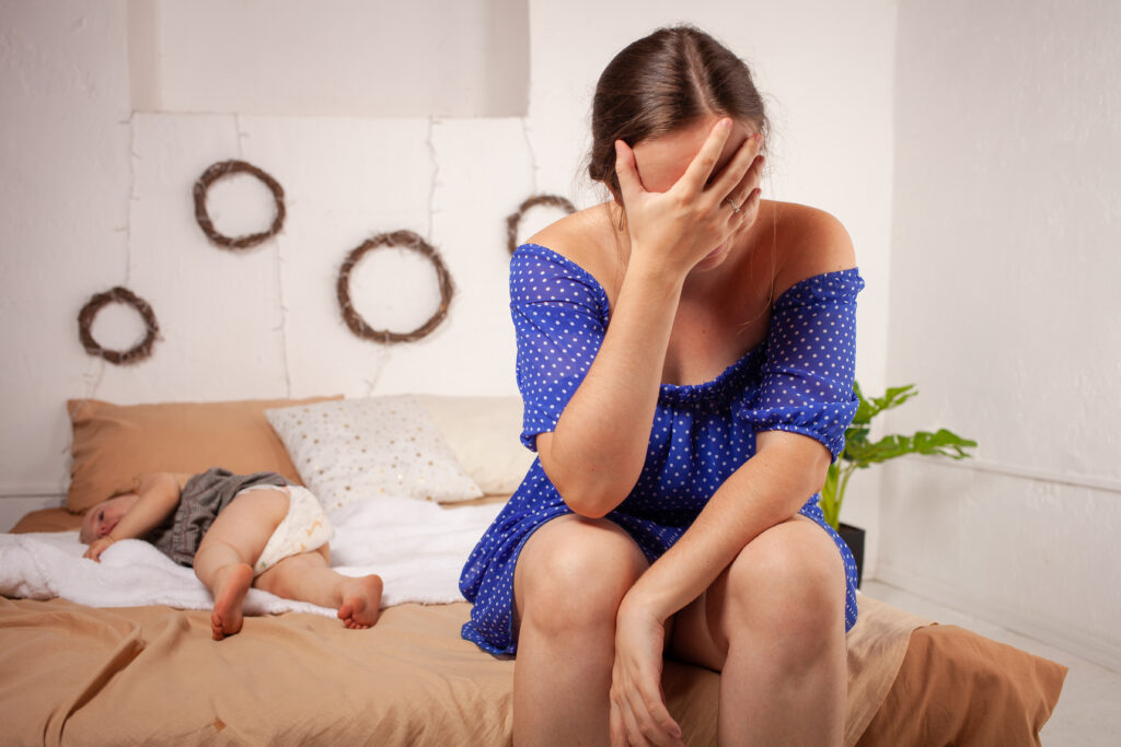 Mom is tired of the baby, wants to rest and sleep. The child screams, hysterical. The woman is tired of the child's cry, she does not want to hear it. A one-year-old girl yells from a toothache.