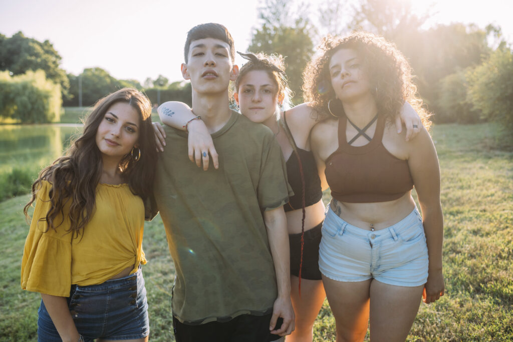 Friends posing by lake