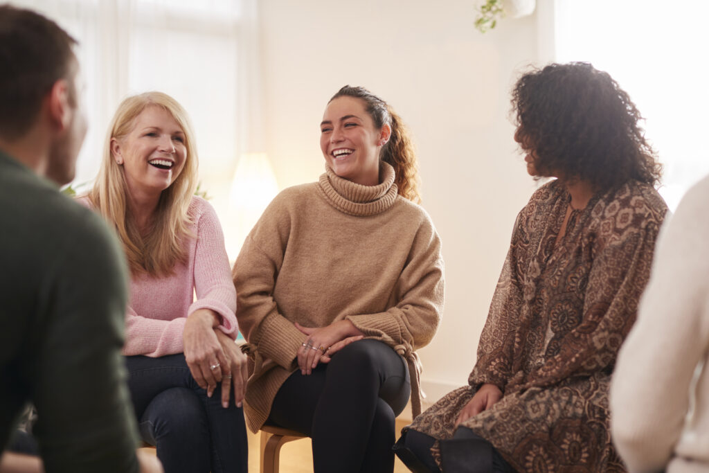 People Attending Support Group Meeting For Mental Health Or Dependency Issues In Community Space