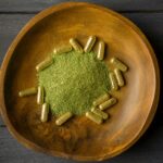 kratom-powder-and-capsules-in-wooden-bowl-2025-01-09-07-57-55-utc