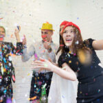 Happy business group people in santa hat having fun for celebrity christmas party.
