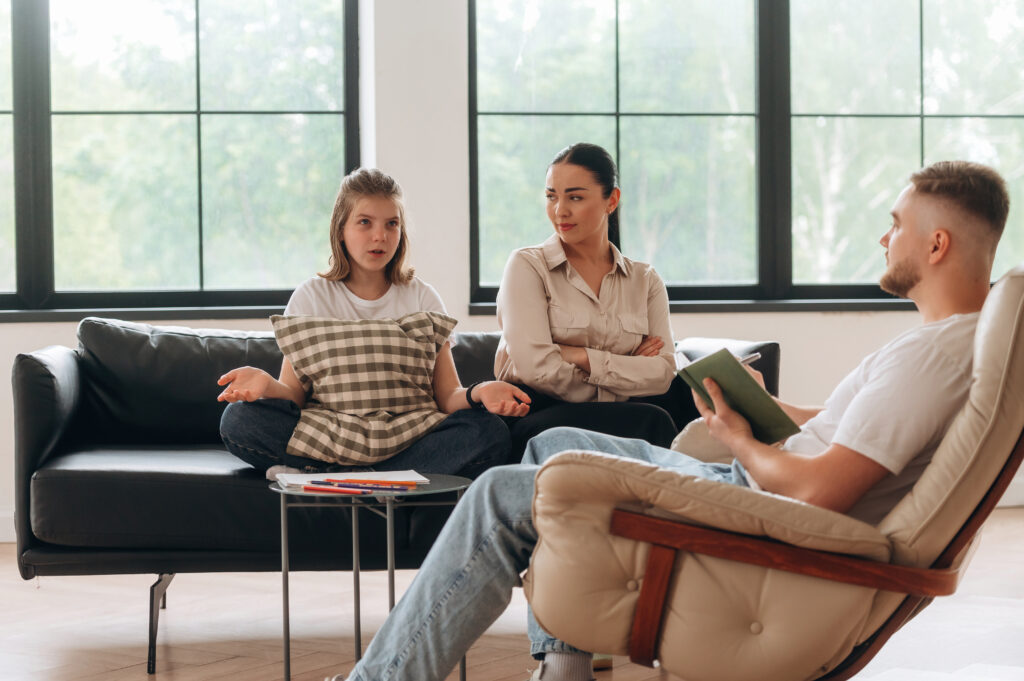 Bad family relationships. Mother with her daughter are at psychologist appointment.