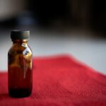 amber-glass-bottle-on-red-background-2025-03-10-12-19-55-utc
